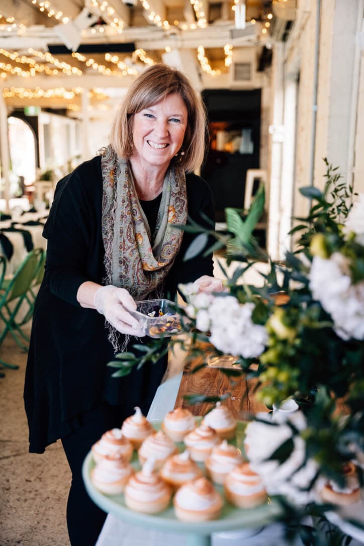 Rose at Event Gourmet & Florals giving the finishing touches to a gorgeous dessert table in Adelaide