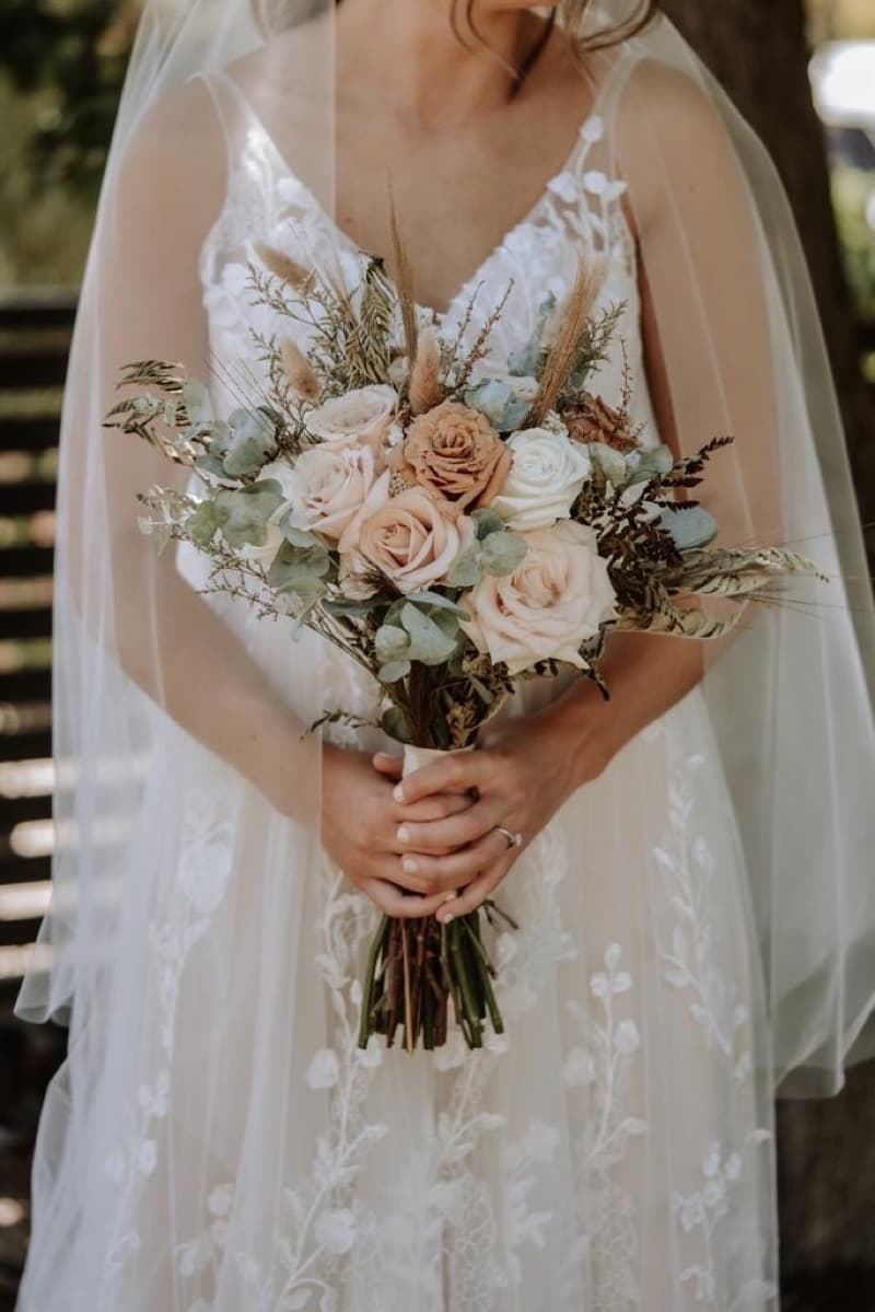 Adelaide bridal bouquet with neutral toned roses and trailing greenery by Event Gourmet